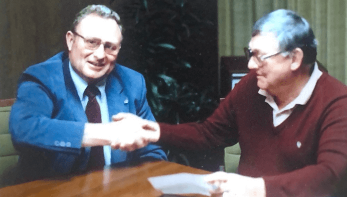 2 men shaking hands