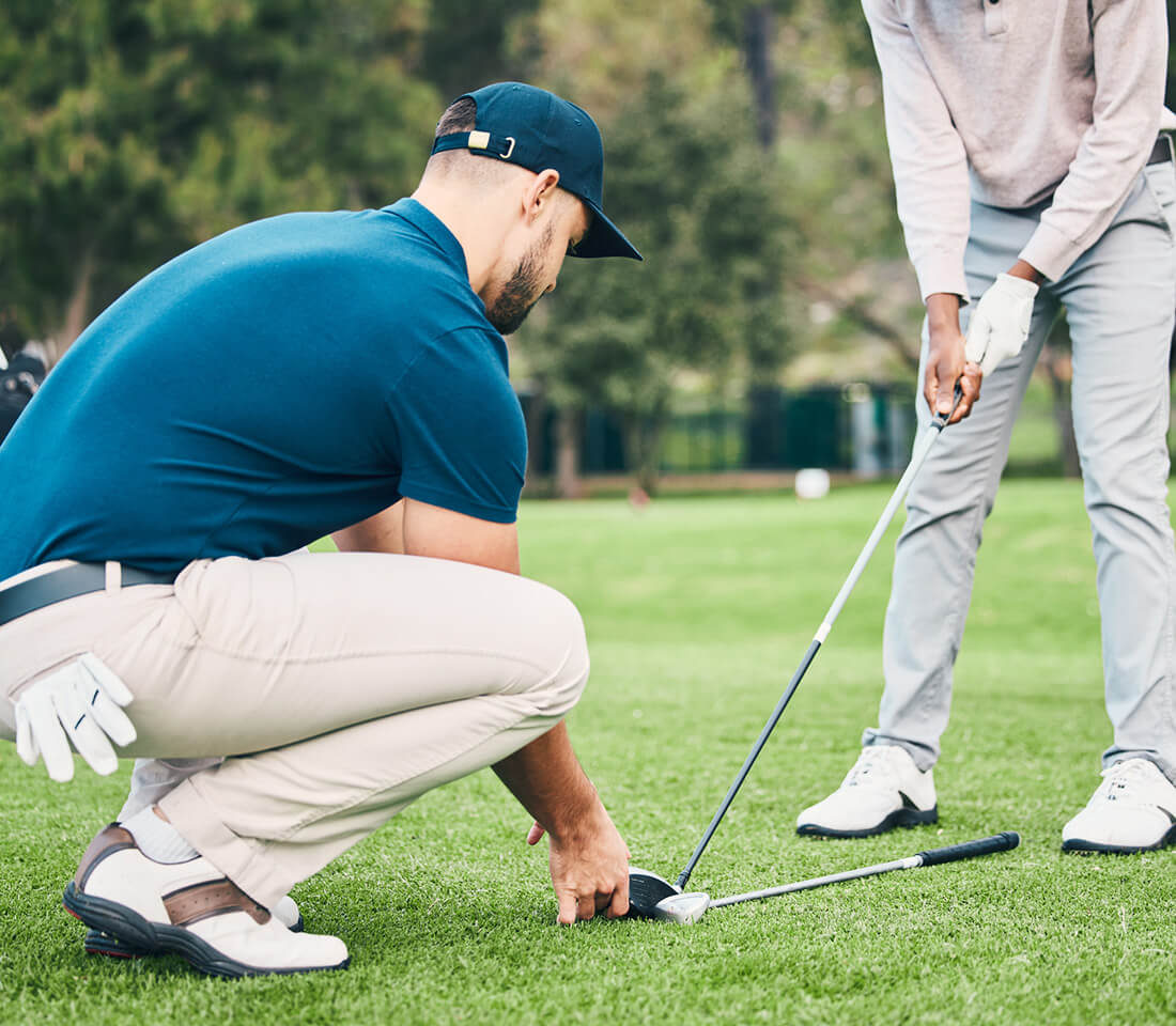 man giving golf lesson