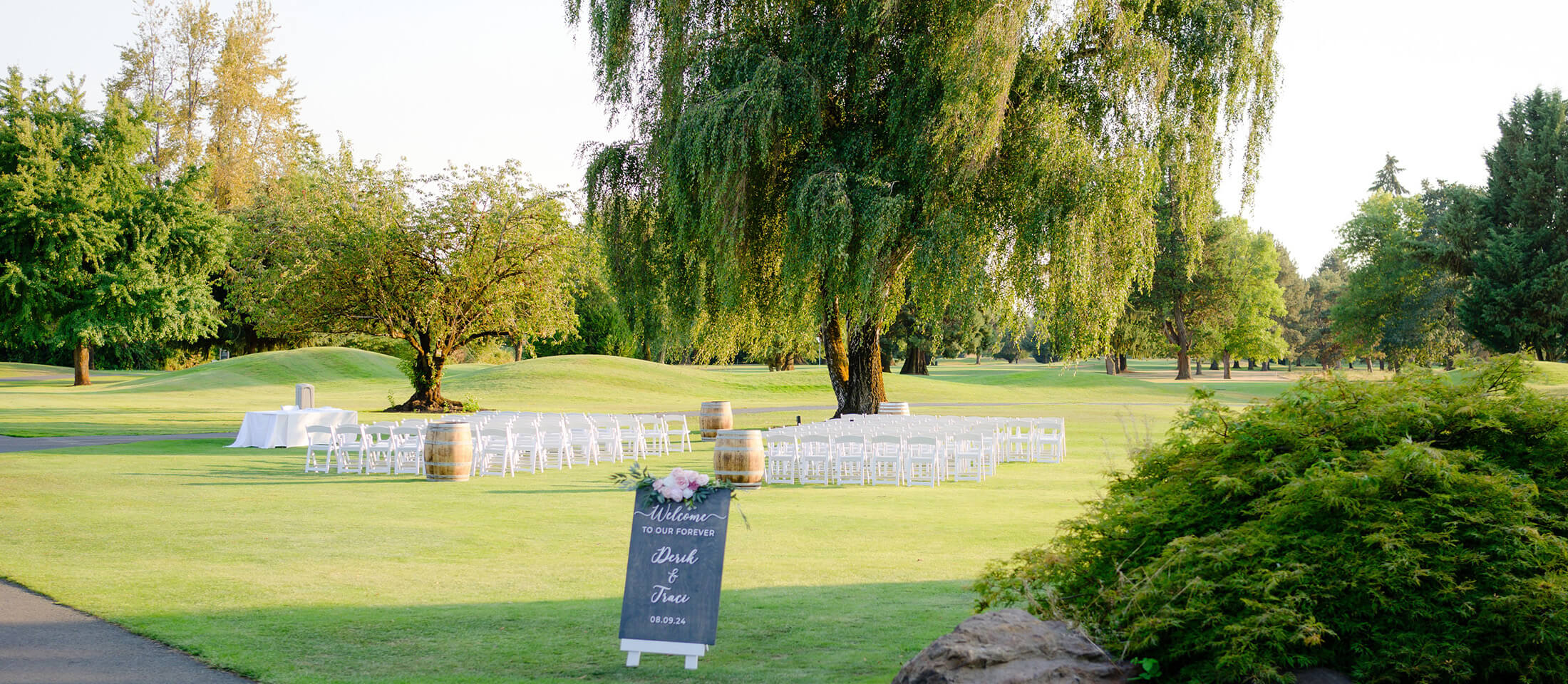 chairs set up outside on grass for ceremony